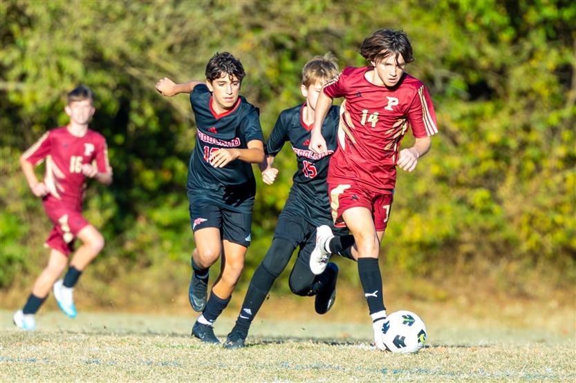 Middle school students play soccer
